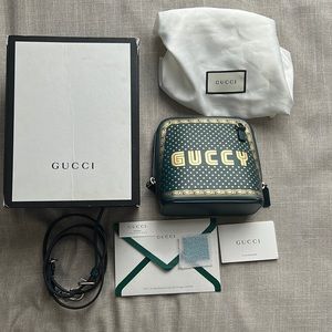 GUCCI WOMEN BLACK GUCCY SEGA SCRIPT DOME MINI CROSSBODY BAG